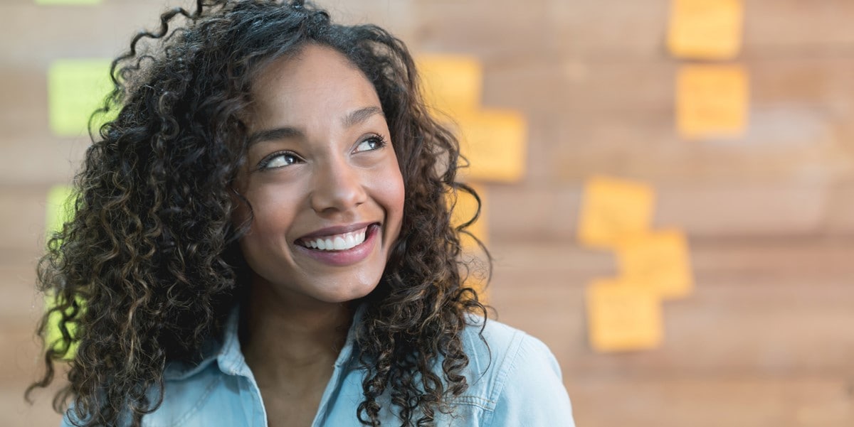 woman smiling looking up