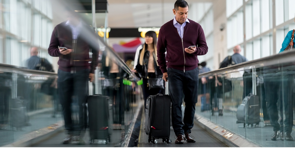 man walking through airport