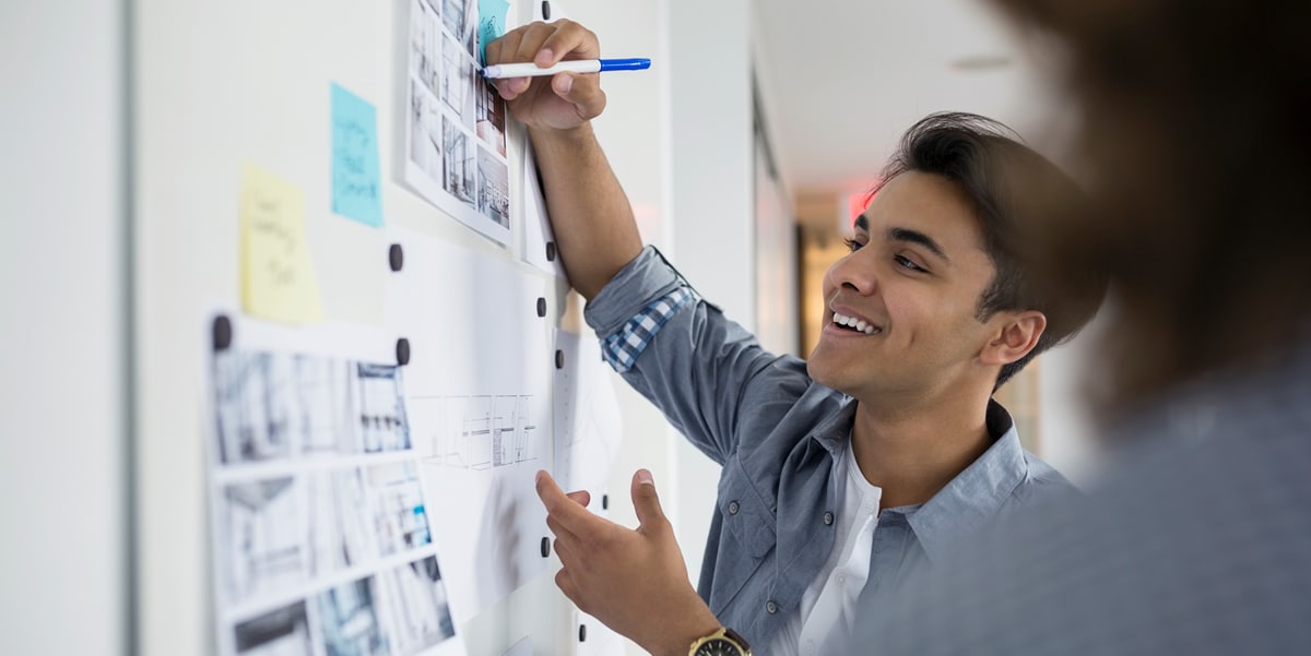 Man writing on whiteboard