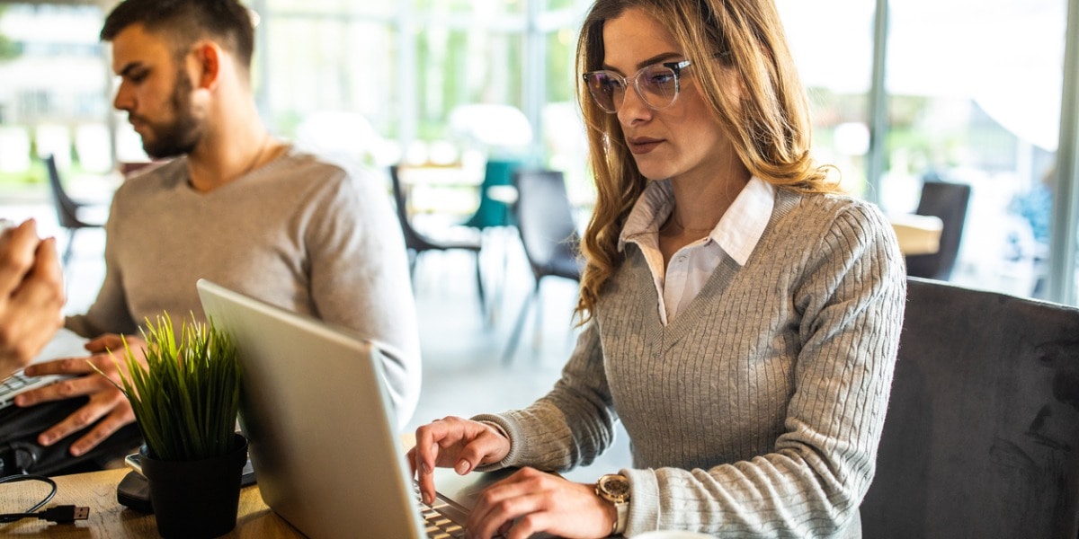 Woman working at a desk on her laptop