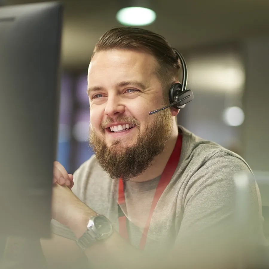 Man in office talking on headset
