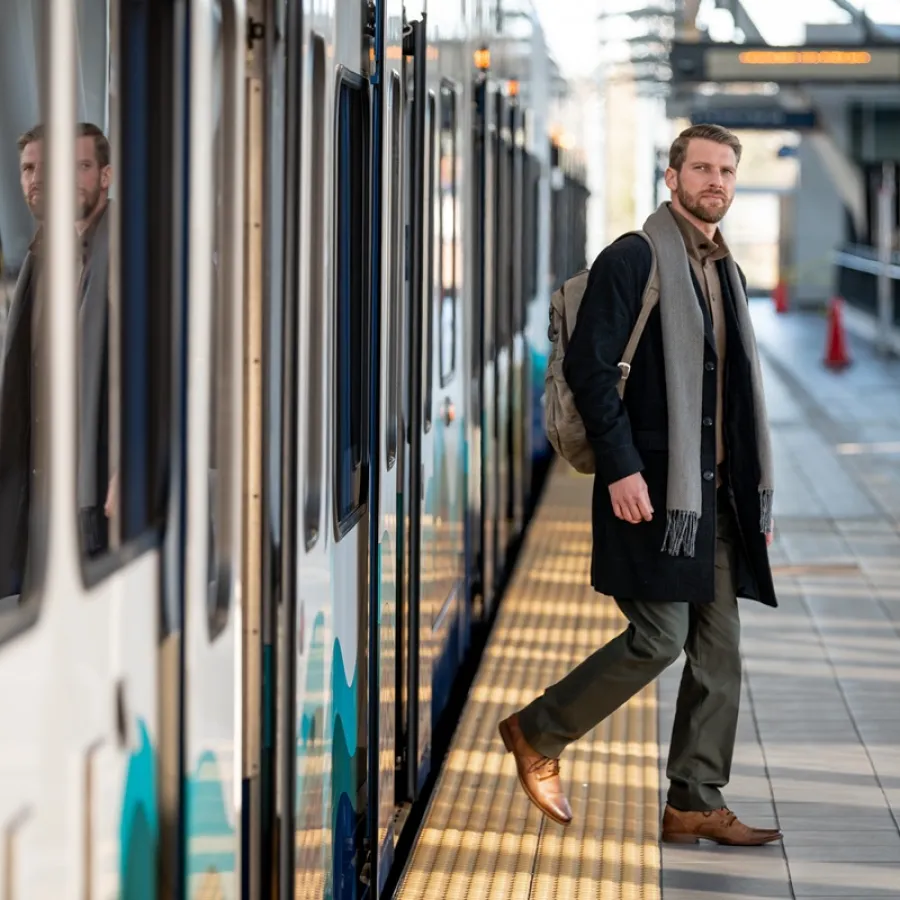 Man getting off train